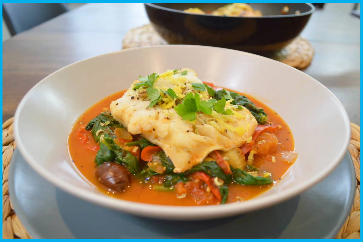 One pan cod with tomatoes, olives and spinach