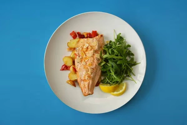 Baked trout, red peppers, potatoes & almonds